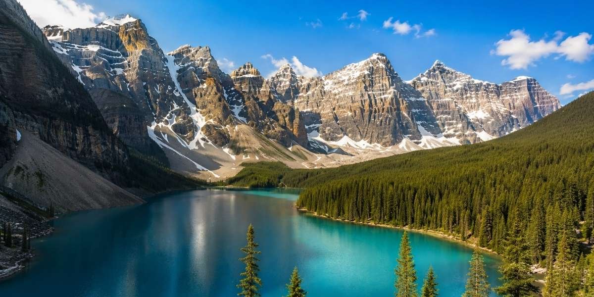 A turquoise lake around the valley of the ten peaks.