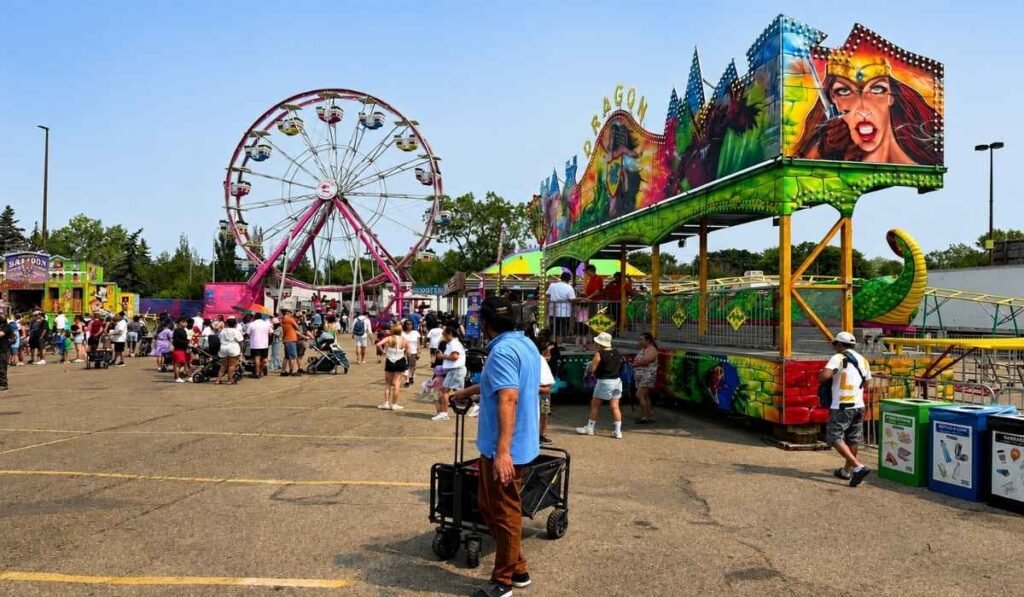 Crowds and carnival rides at K-Days in Edmonton, Alberta